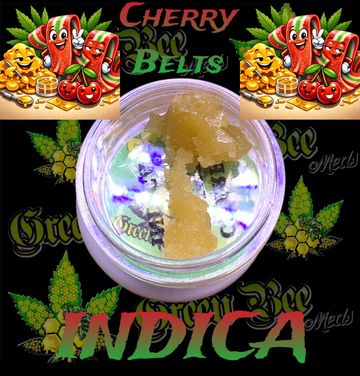 Cherry Bee Belts Indica cannabis concentrate in a jar with colorful branding.