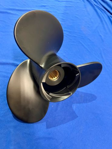 Black three-blade propeller on a blue surface.
