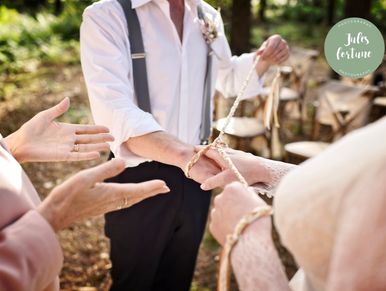 Close up shot of Handfasting ceremony in woodland setting.  
Image by @julesfortunephotography