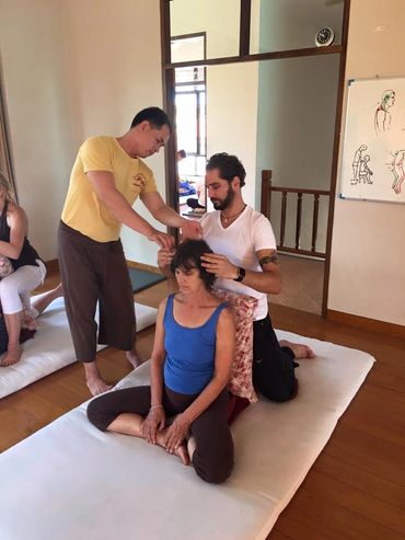 Master Therapist learning Thai massage from  Suriyan Punyafoo