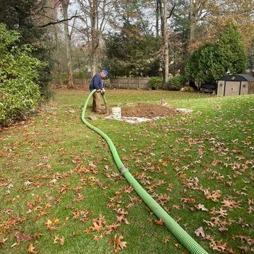 Pumping a septic tank.