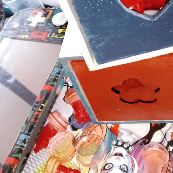 Colorful gaming console and decorative items on a table.