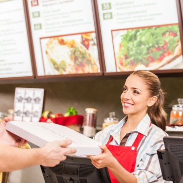 Retail Management Inc - Cashier smiling