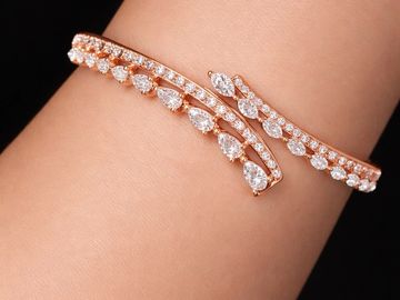 Elegant rose gold bracelet adorned with sparkling diamonds.