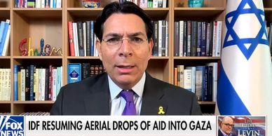 Man in suit discusses IDF aid drops into Gaza on Fox News.