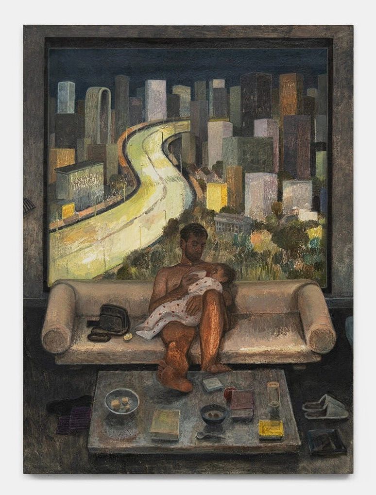 A man sitting on a sofa holds a baby while surrounded by a cluttered coffee table and a city skyline visible through a window at night.