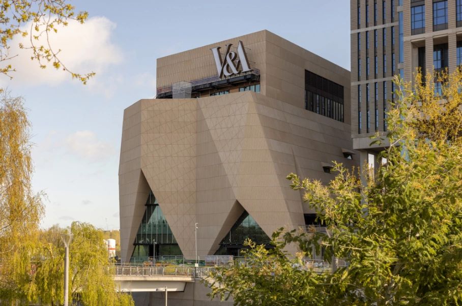 Exterior view of the V&A Museum featuring its distinctive angular architecture and large signage.