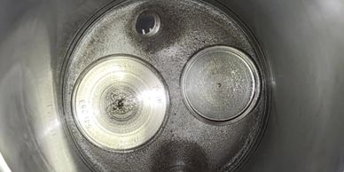 Close-up of a metal cylinder with two circular components inside.