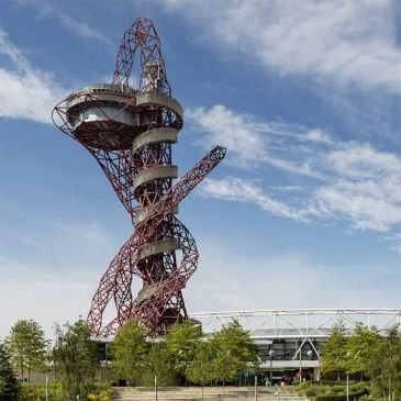 The ArcelorMittal Orbit sculpture under a blue sky.
