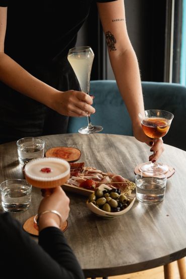 Cocktails being served on a table during the day 