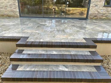 Porclain patio with engineering blue coping and steps