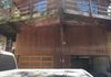 Deck and garage before repairs and stain