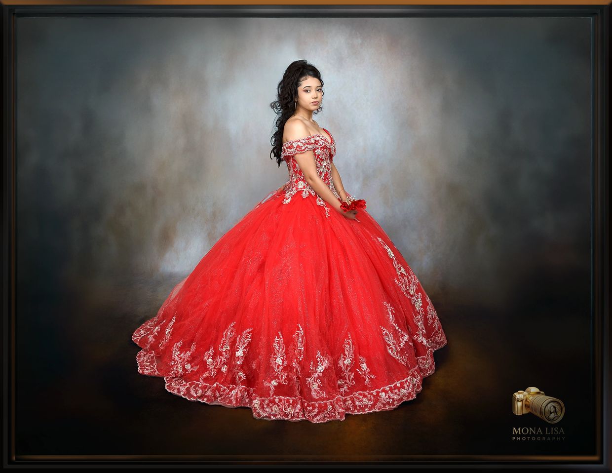 Young woman in a vibrant red ball gown.