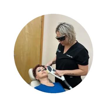 A Woman Lying on a Chair Getting Her Treatment Performed