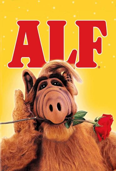 ALF character holding a rose in his mouth with a yellow background.