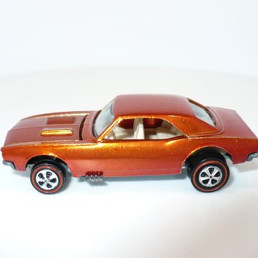 Orange toy car model with a sleek design.