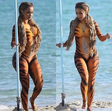 Cardi b body painted like a tiger for her twerk video with young miami 