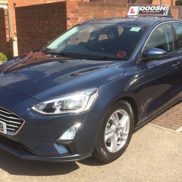 Ford Focus automatic driving school car in blue with dual controls