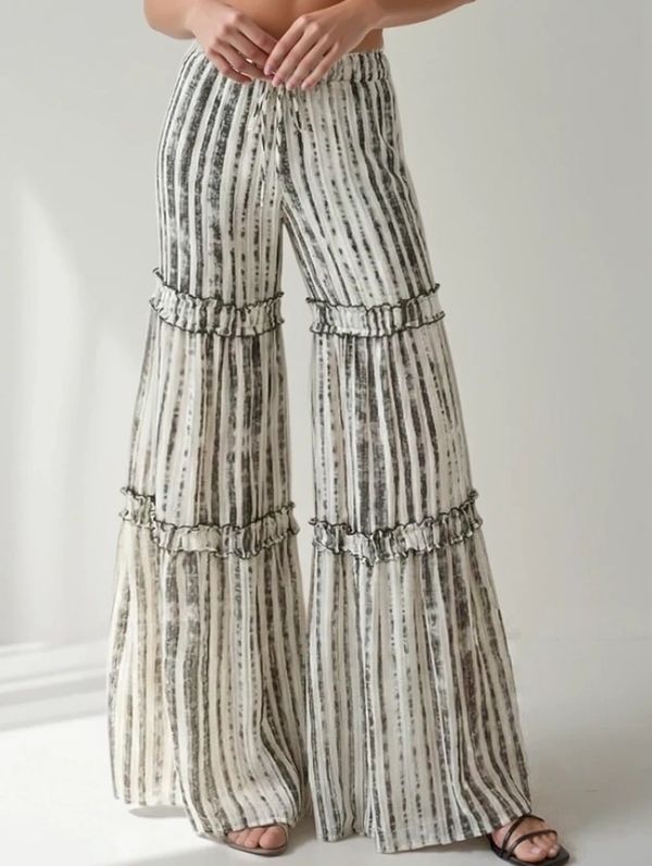 Striped wide-leg pants with ruffle details at the knees.