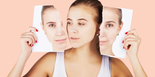 Woman holding torn photos of her face, showing different expressions.