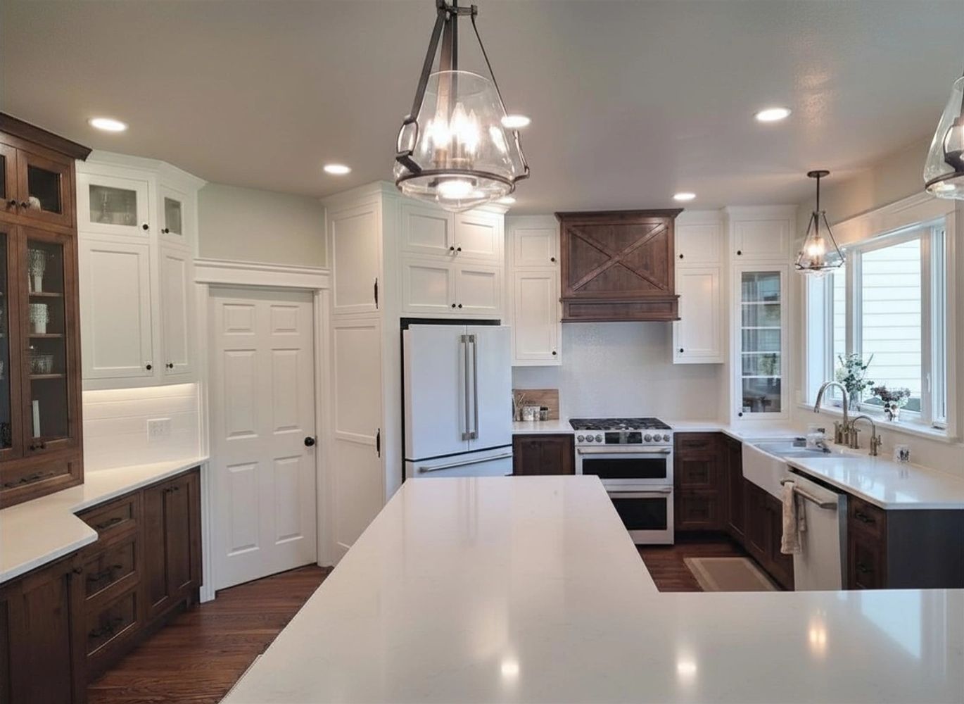 Modern kitchen with white and wooden cabinets. 