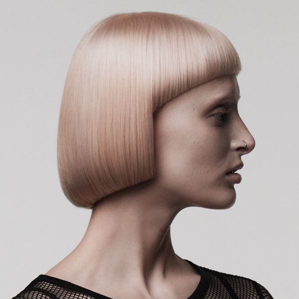 Woman with angular bob, turned to side