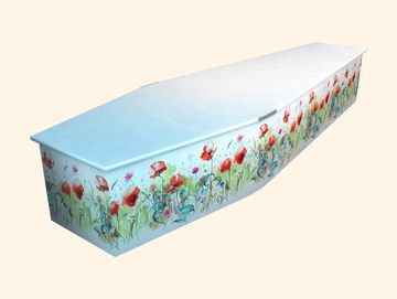 White coffin decorated with red flowers.