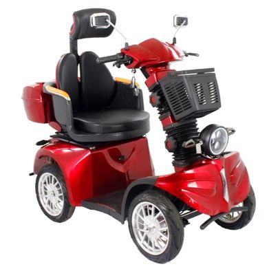 Red mobility scooter with black seat and basket.