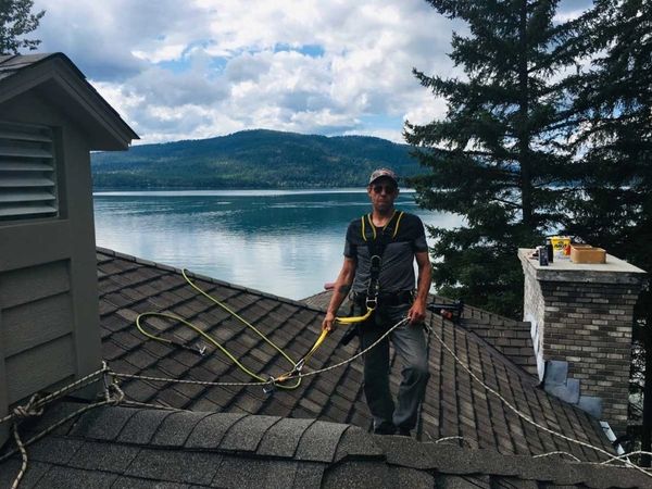 A man standing on the roof of the building