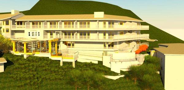 Modern multi-story building with balconies on a hillside.
