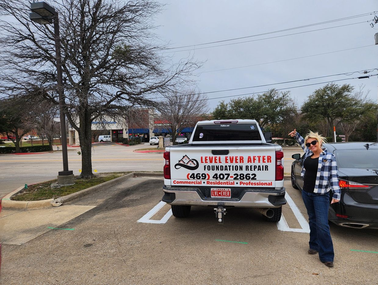 Level Ever After business owner Carrie Yarbrough standing next to work truck in Greenville, TX