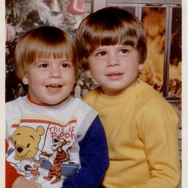 Boys in yellow and Winnie the Pooh shirts.