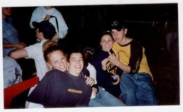 Group of four teenagers hanging out.