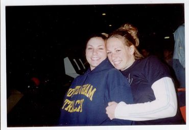 Two young women smiling for photo.