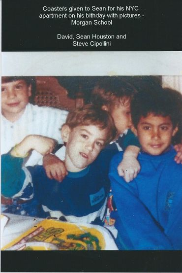 Three young boys smiling for photo.