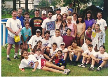 Youth basketball team group photo in a gym.