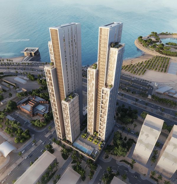 Two modern skyscrapers near the waterfront with a pool between them.