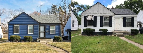Two small single-story houses with front yards and shrubs.