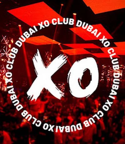 Logo of XO Club Dubai with a lively red-lit crowd in the background.