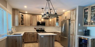 Modern kitchen with wooden cabinets and stainless steel appliances.