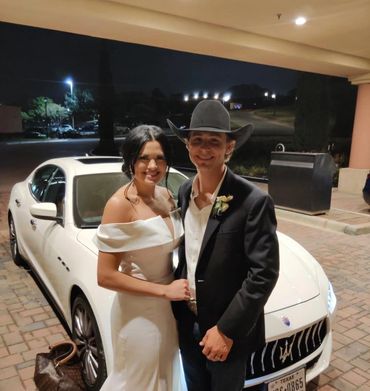 newly wed couple taking exotic car wedding exit 
