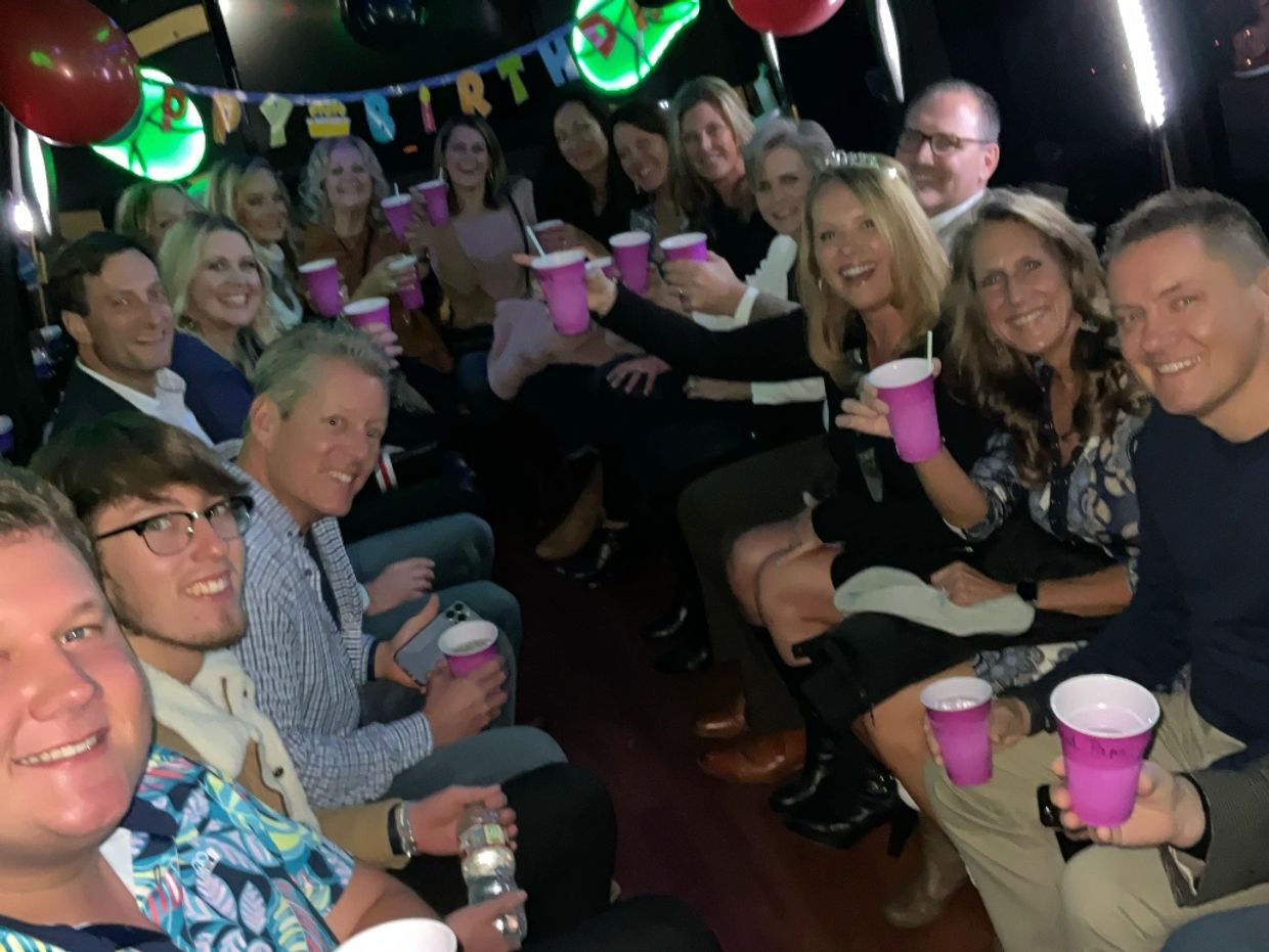 large group in karaoke party bus