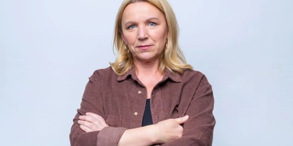 Confident woman with arms crossed.