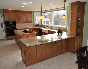 Granite counters and island in a large kitchen.