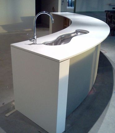 White wet bar with wavy sink hole