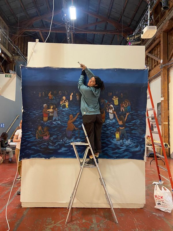 Enya Fontanills, artist setting up artwork in gallery space