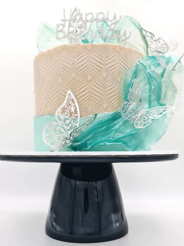 Lemon cake decorated in duck egg blue and cream. Butterflies, Sails and Stencil effect on cake.