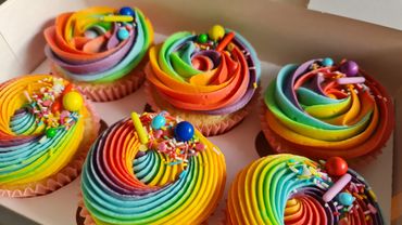 Rainbow cupcakes. Vanilla cupcakes with rainbow coloured buttercream and sprinkles.