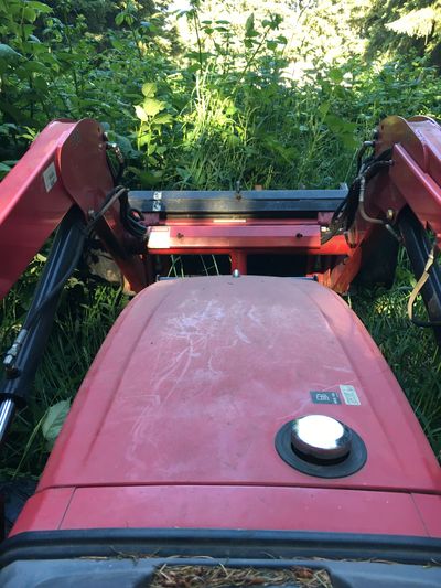 Mowing thick brush and grass to reclaim a property, create defensible space and reestablish a pastur