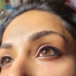 A Woman With Brawn Eyes